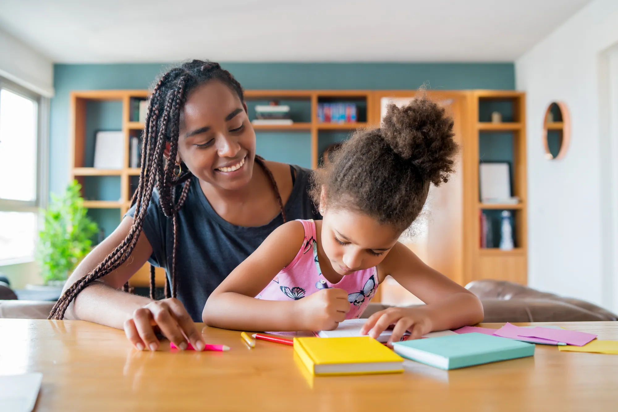 A tutor supporting a young learner